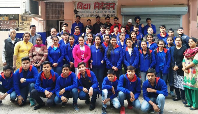 Vidya Niketan Open School Ramesh Nagar, West Delhi students with faculty members, outside the institute
